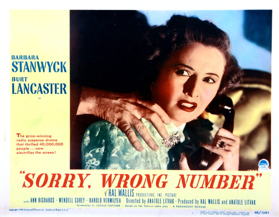poster for the 1948 movie "Sorry, Wrong Number." It is an illustrated picture of star Barbara Stanwyck holding a phone up to her ear and looking scared as a hand behind her is touching her right shoulder.