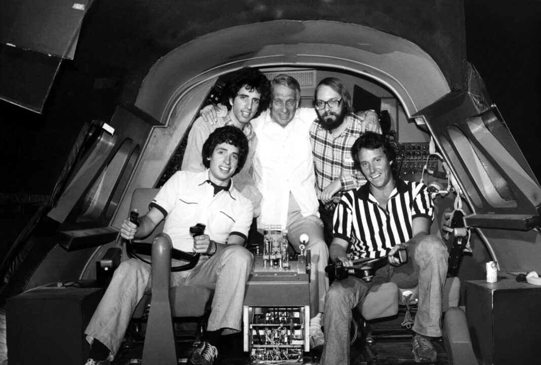 AIRPLANE!, (clockwise from bottom left) David Zucker, Jerry Zucker, Howard Koch, Robert K. Weiss, Jim Abrahams, on set, 1980