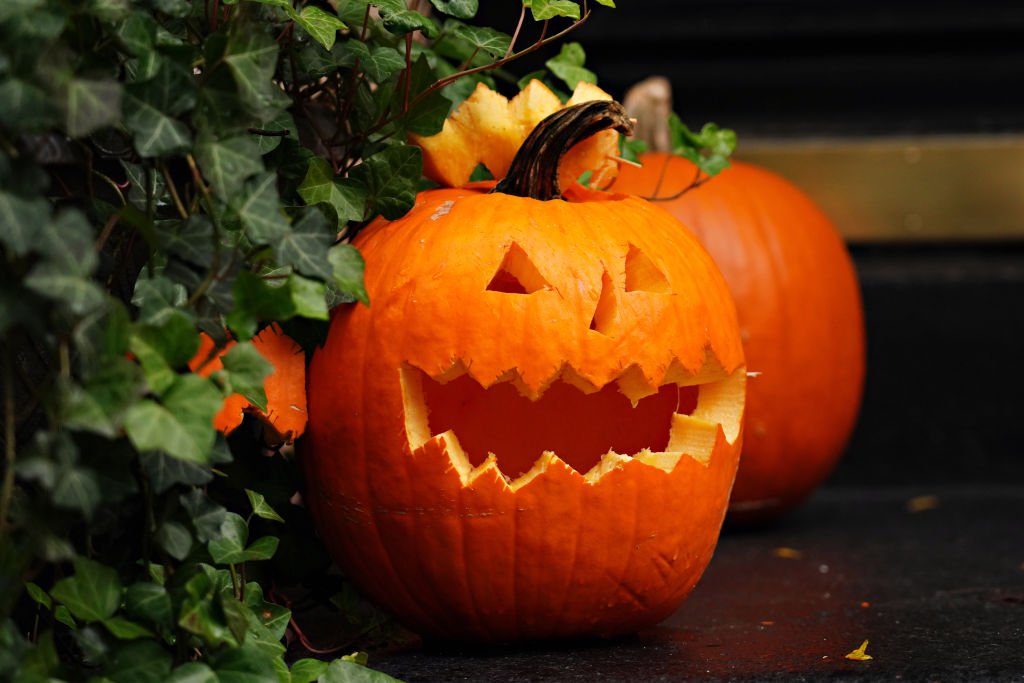 NEW YORK, NEW YORK - OCTOBER 30: A carved pumpkin is part of a Halloween display in front of an Upper East Side home on October 30, 2020 in New York City