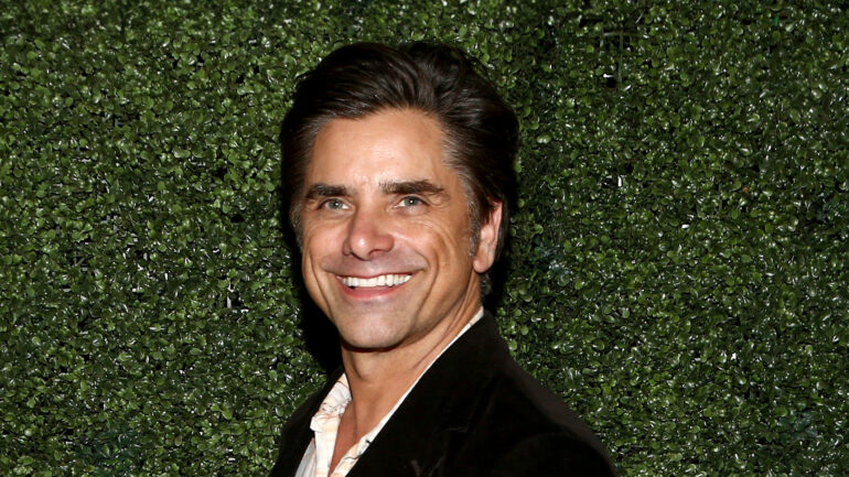 LOS ANGELES, CALIFORNIA - OCTOBER 13: John Stamos attends Wheelhouse and Rally's celebrity and content-creator private fund raise event, with rare collectibles on display from sports, culture and history on October 13, 2021 in Los Angeles, California. Rally is a Fractional Investing Platform for Collectibles.