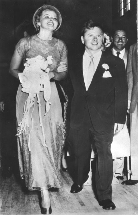 Just married actors Martha Vickers (1925 - 1971) and Mickey Rooney walk down the aisle of a church after their wedding ceremony, North Hollywood, California, June 3, 1949.