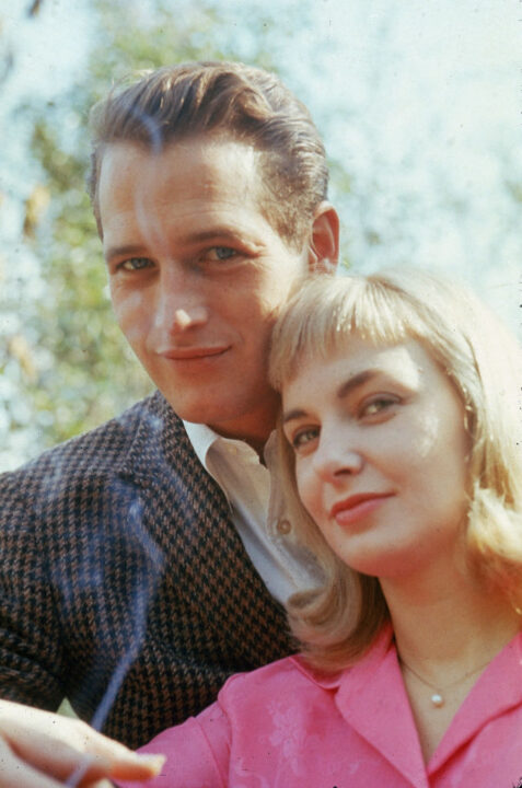 Portrait of married American actors Paul Newman and Joanne Woodward standing outdoors, circa 1962