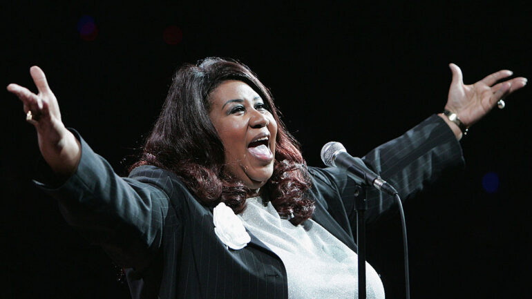 AUBURN HILLS, MI - JUNE 15: Singer Aretha Franklin performs the national anthem before the Detroit Pistons take on the Los Angeles Lakers in game five of the 2004 NBA Finals on June 15, 2004 at The Palace of Auburn Hills in Auburn Hills, Michigan. NOTE TO USER: User expressly acknowledges and agrees that, by downloading and or using this photograph, User is consenting to the terms and conditions of the Getty Images License Agreement