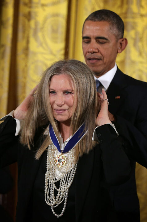WASHINGTON, DC - NOVEMBER 24: U.S. President Barack Obama (R) presents the Presidential Medal of Freedom to singer Barbra Streisand (L) during an East Room ceremony November 24, 2015 at the White House in Washington, DC. Seventeen recipients were awarded with the nations highest civilian honor