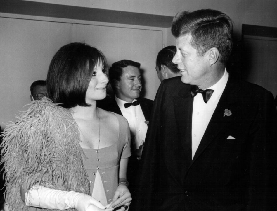 381091 69: President John F. Kennedy speaks with Barbra Streisand at an event May 24, 1963