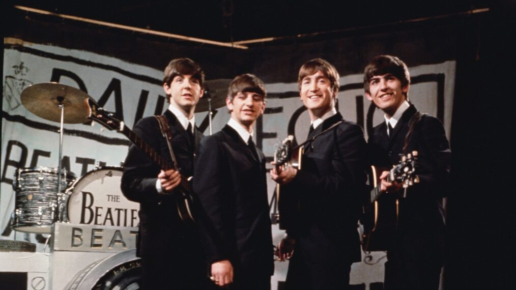 25th November 1963: Liverpudlian beat combo The Beatles, from left to right Paul McCartney, Ringo Starr, John Lennon (1940 - 1980), and George Harrison (1943 - 2001), performing in front of a camera-shaped drum kit on Granada TV's Late Scene Extra television show filmed in Manchester, England on November 25, 1963.