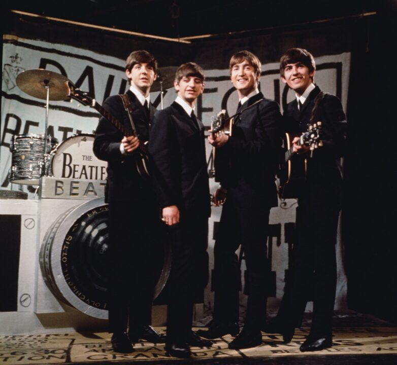 25th November 1963: Liverpudlian beat combo The Beatles, from left to right Paul McCartney, Ringo Starr, John Lennon (1940 - 1980), and George Harrison (1943 - 2001), performing in front of a camera-shaped drum kit on Granada TV's Late Scene Extra television show filmed in Manchester, England on November 25, 1963