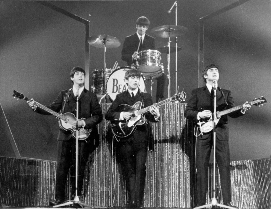 The Beatles on stage at the London Palladium during a performance in front of 2, 000 screaming fans