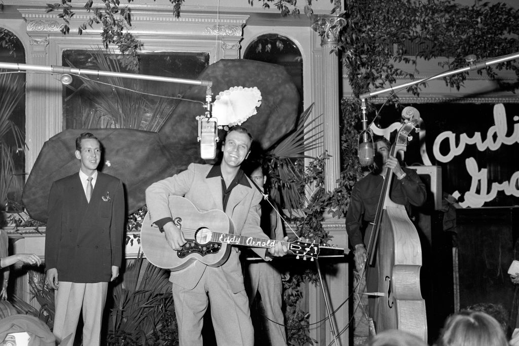 Country singer songwriter Eddy Arnold performs for the WMAK radio station toy drive 1950 in Nashville, Tennessee