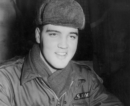 17th December 1958: US rock 'n' roll singer Elvis Presley (1935 - 1977) in military uniform during his stint as a US serviceman at the Grafenwoehr exercise camp, Germany. 