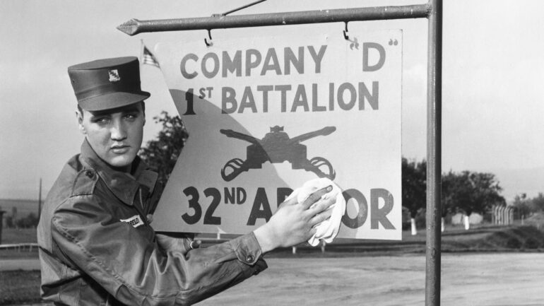 Elvis Presley poses for the camera during his military service at a US base in Germany.