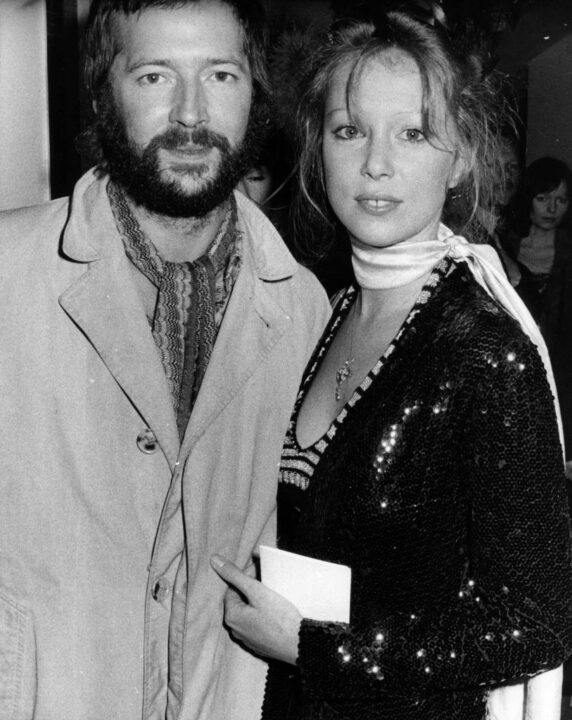 British blues-rock guitarist Eric Clapton and his girlfriend fashion model Patti Boyd, ex-wife of ex-Beatle George Harrison, pictured at the premiere of the rock musical film 'Tommy' in London's Leicester Square, 26th March 1975