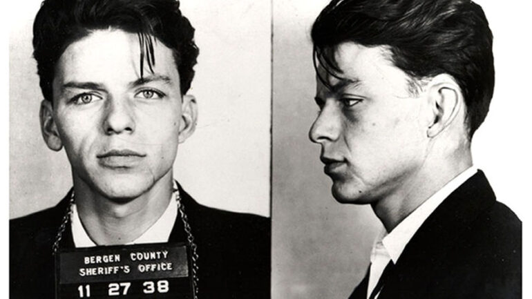 BERGEN COUNTY, NJ - 1938: Pop singer Frank Sinatra poses for a mug shot after being arrested and charged with