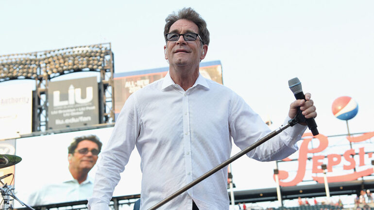 NEW YORK, NY - JULY 12: Singer Huey Lewis of the band Huey Lewis & the News performs in concert at Citi Field on July 12, 2014 in New York City