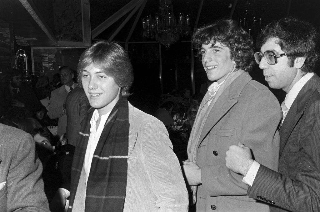 James Spader (L) and John F. Kennedy Jr. (2nd from R) attend a party at Tavern on the Green in New York City on December 12, 1977