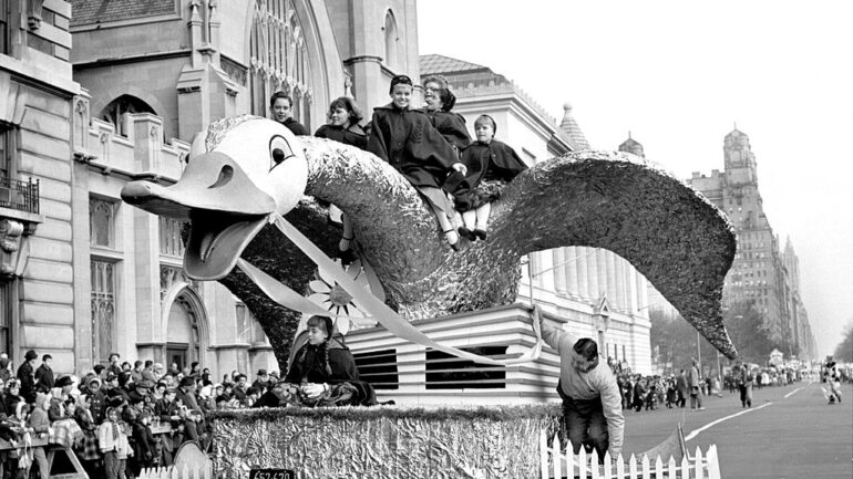 UNITED STATES - NOVEMBER 23 1961: Thanksgiving Day is the day when Americans traditionally pause to count their blessing, have a good turkey dinner, and then start looking forward to Christmas. One of the annual highspots is Macy's Thanksgiving Day Parade. The floats, bands and balloons set out from Central Park West at 77th Street, swung down Broadway and ended up at Macy's. Martha Wright, star of 