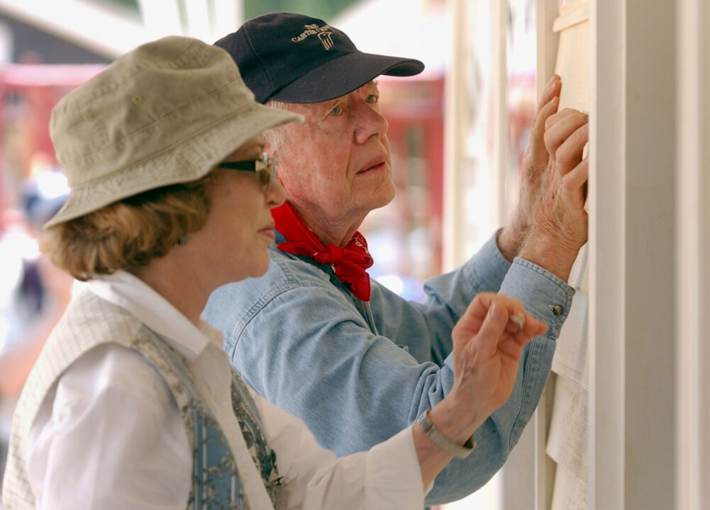 LAGRANGE, GA - JUNE 10: Former U.S. President Jimmy Carter and his wife Rosalyn attach siding to the front of a Habitat for Humanity home being built June 10, 2003 in LaGrange, Georgia. More than 90 homes are being built in LaGrange; Valdosta, Georgia; and Anniston, Alabama by volunteers as part of Habitat for Humanity International's Jimmy Carter Work Project 2003. 