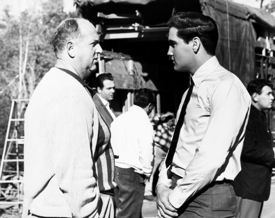 KID GALAHAD, Elvis Presley, right, with manager 'Colonel' Tom Parker, on-set, 1962