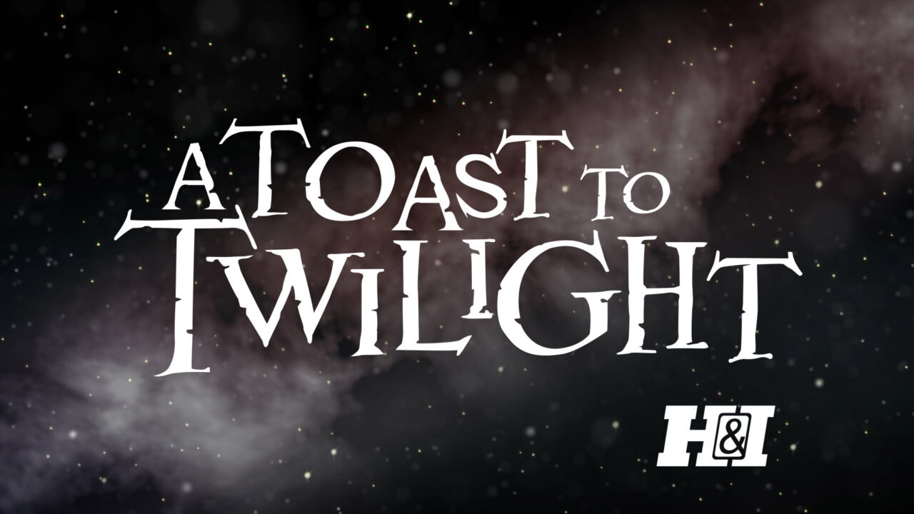 logo for H&I Network's 2023 "A Toast to Twilight" New Year's Eve marathon of "Twilight Zone" episodes. The text "A Toast to Twilight" is written in white lettering using a similar font to that of the original series' title, and is also set against a starry background, like the show's opening title credits. Below right of the title is the H&I network logo, also in white.