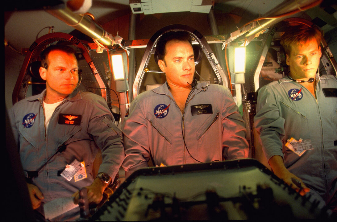 image from the 1995 movie "Apollo 13." Sitting in a space capsule are astronauts portrayed by, left to right, Bill Paxton, Tom Hanks and Kevin Bacon.