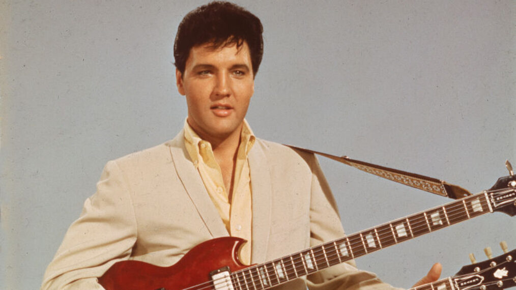 Portrait of American singer and actor Elvis Presley (1935 - 1977) holding a 1965 Gibson EBS-1250 Double Bass (a combined 6-string and bass guitar), circa 1966. Elvis is seen playing the guitar in his 1966 film, 'Spinout'