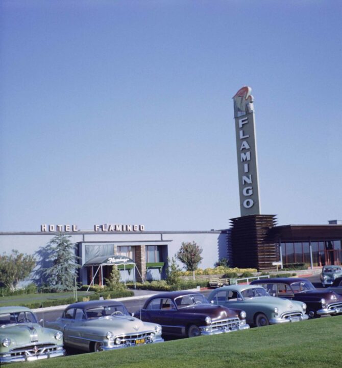 Daytime view of cars parked in front of the Flamingo Hotel and Casino, Las Vegas, Nevada, late 1940s