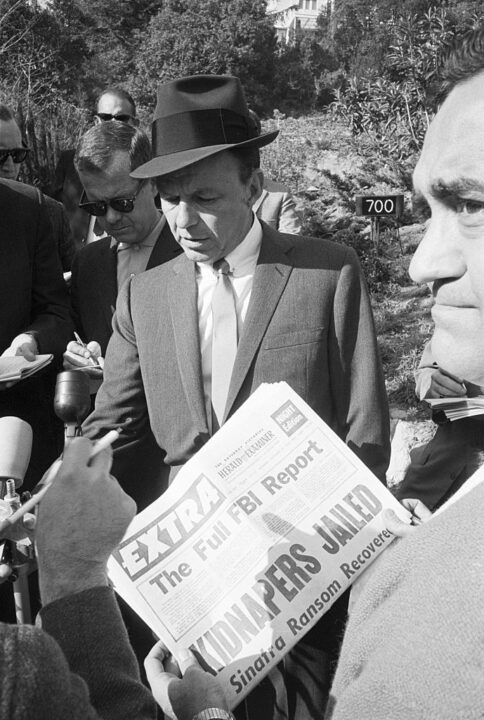 Frank Sinatra speaks at a press conference for the first time since the capture of the kidnappers of Frank Sinatra, Jr. in the driveway of his ex-wife's home.