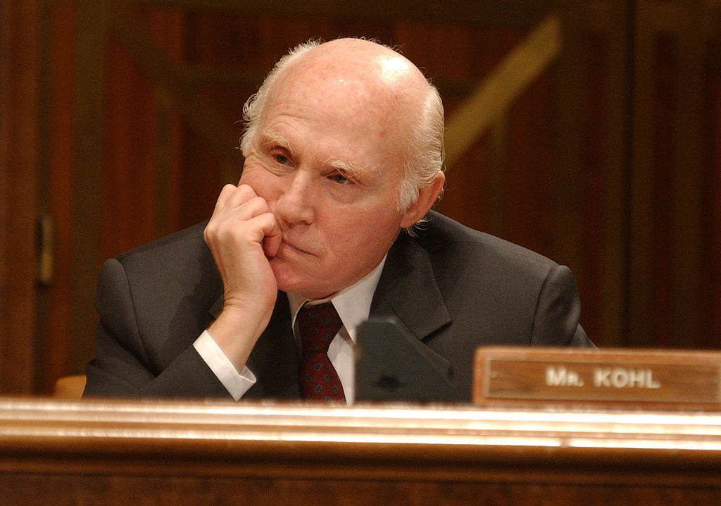 Sen. Herbert Kohl, D-Wis., listens to Colin Powell at a hearing on the FY04 budget for the State Department and potential military action in Iraq