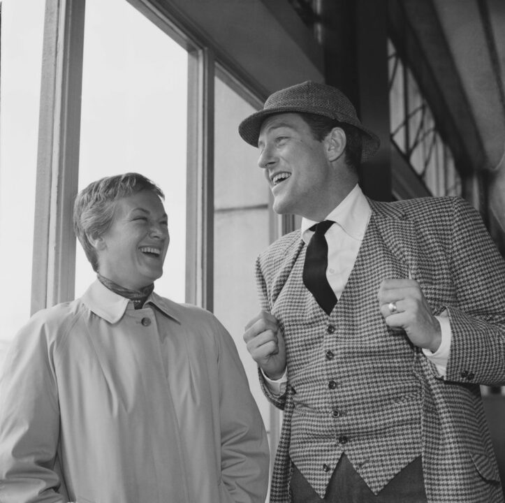 American actor Dick Van Dyke laughs with his wife Margie Willett (1915 - 2008) upon their arrival in Southampton, UK, 15th April 1964