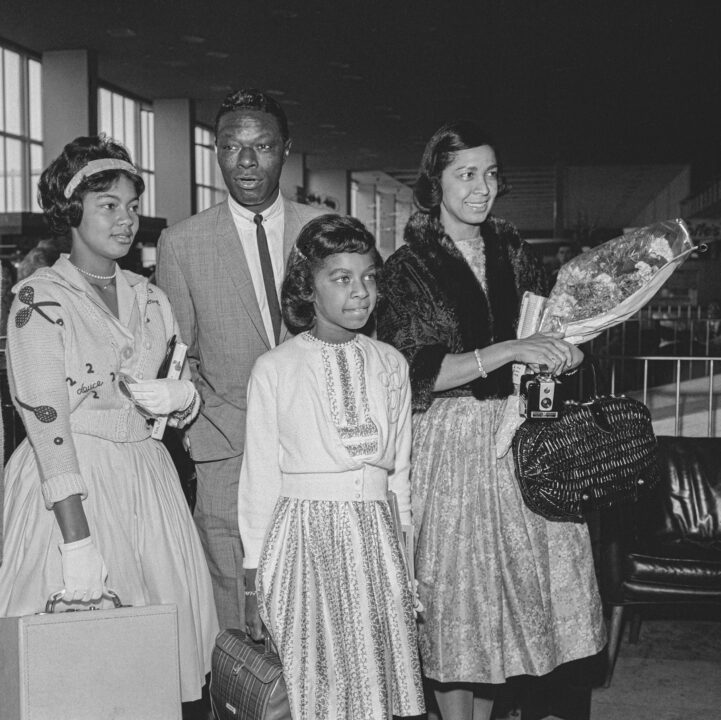 American jazz pianist and singer Nat King Cole (1919 - 1965) at London Airport with his wife Maria (1922 - 2012) and their daughters Natalie (1950 - 2015) and Carole (1944 - 2009, left), 3rd August 1960. The family are on their way to Monaco to take part in the annual ball held by Prince Rainier and Princess Grace. 