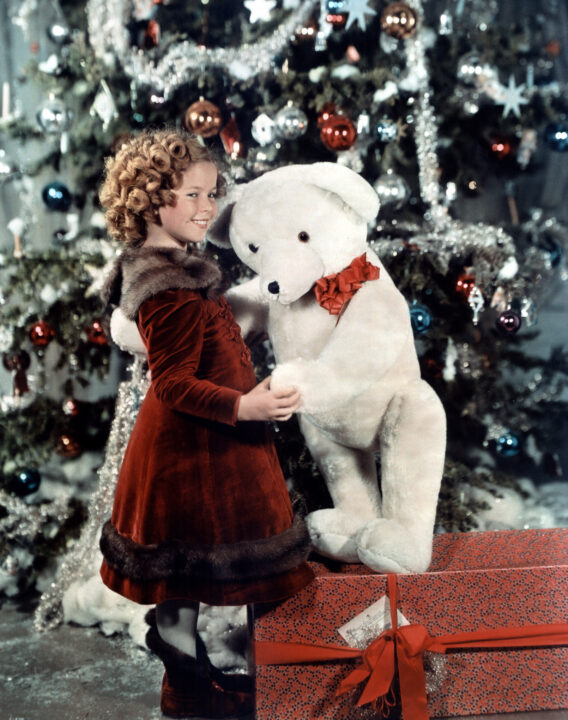 Bright Eyes Shirley Temple, 1934, with a Christmas tree