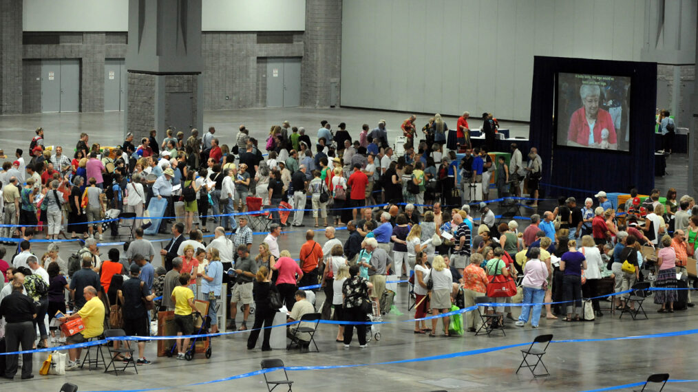 August 2010 image of a large crowd of people gathered in line awaiting their chance to have collectible items appraised by the PBS series 