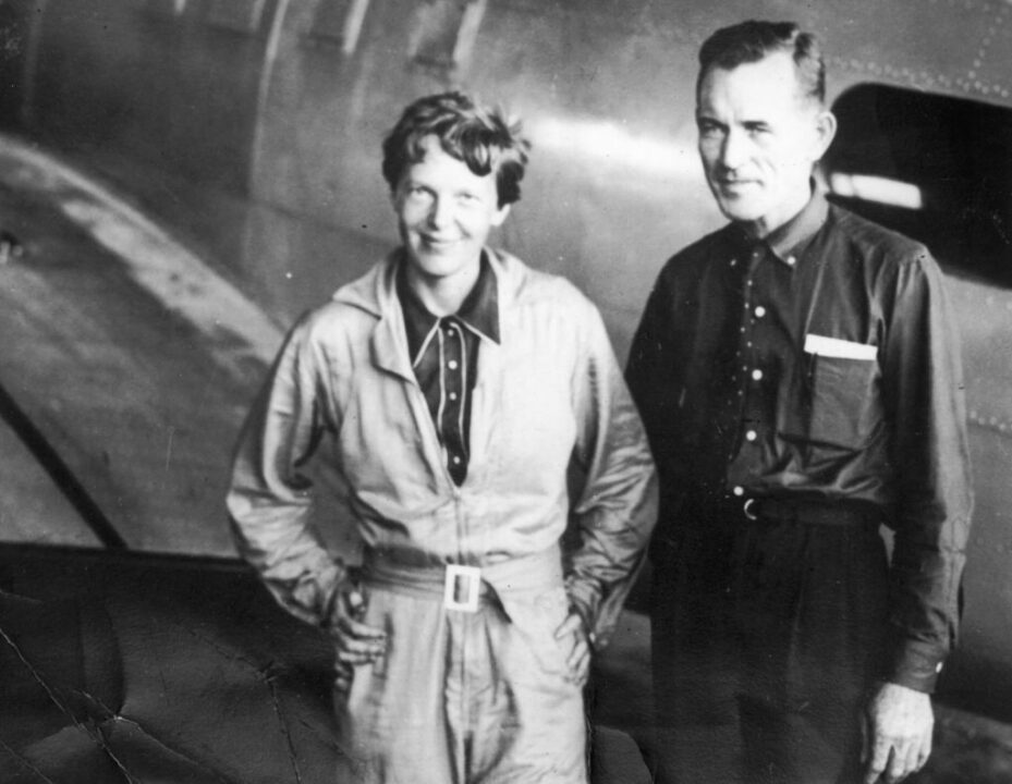 11th June 1937: : American aviatrix Amelia Earhart (1897 - 1937) with her navigator, Captain Fred Noonan, in the hangar at Parnamerim airfield, Natal, Brazil, 11th June 1937. Together they are attempting a circumnavigation of the globe