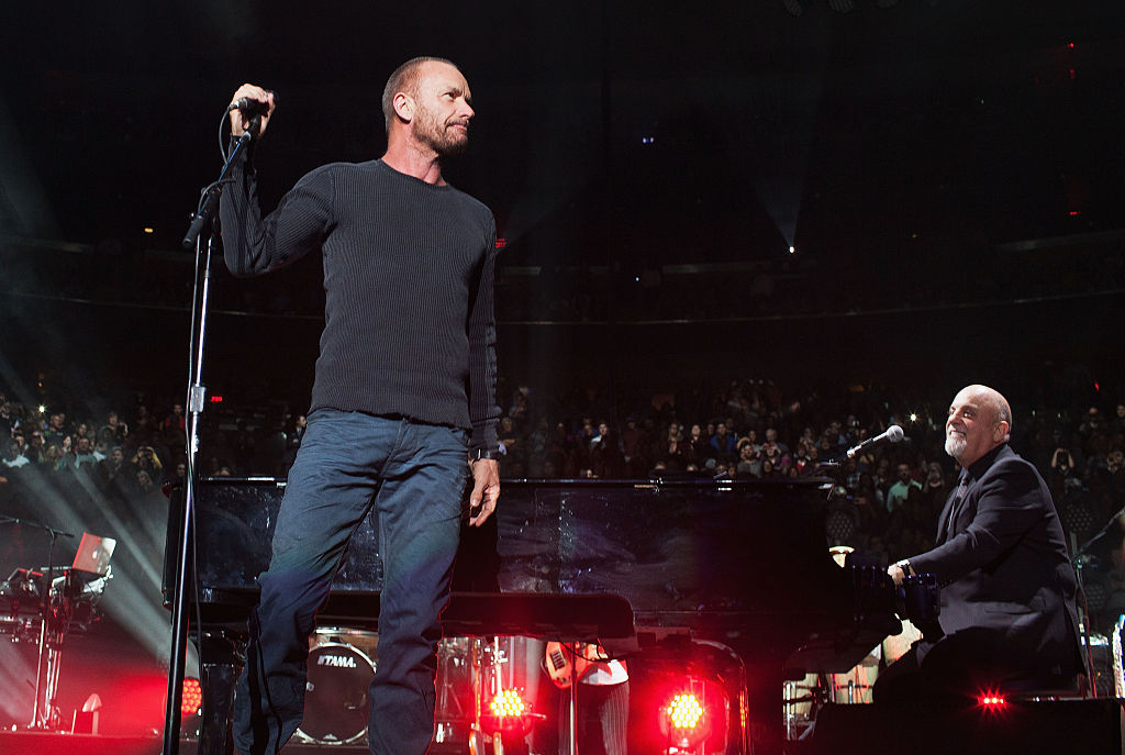 Sting (L) and Billy Joel perform at Madison Square Garden on November 25, 2014 in New York City