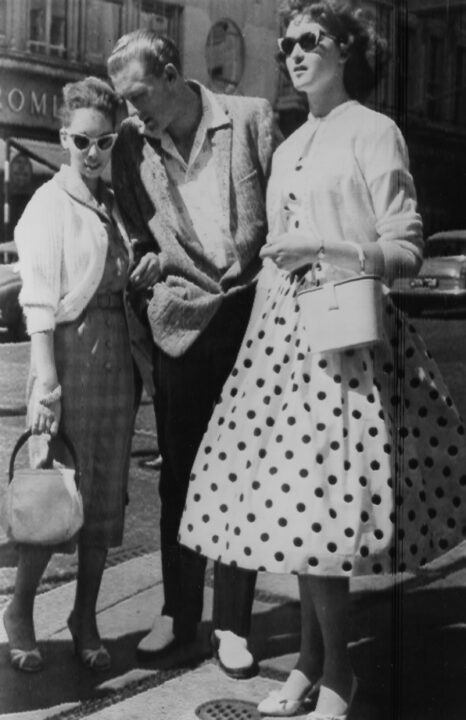 FG1371779...Watch Credit: United Press International RadioTelephoto Slug: (Lewis-Wife) Rock 'n' Roller and 13-year-old bride in London London, Eng. Rock and roll singer Jerry Lee Lewis is shown with his 13-year-old wife, Myra (left) and her sister, Frankie, chatting on the sidewalk of a street in London, where Lewis is currently appearing. Myra, the singer's third wife, is the daughter of Mr. and Mrs. J.W. Brown of Memphis, Tenn., and a cousin of her husband. Her Father plays the base fiddle in Lewis' musical accompaniment. w.5.23.58 (North American Rights Only) Central Press Association May 26, 1958