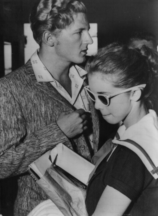 MPP5/28Memphis: A serious rock n ' roll star Jerry Lee Lewis and schoolgirlish 13 year old Myra, his wife answer newsmens' questions at MemphisAirport After sudden cancellation of London tour over his marital life."I'd marry her 100 times if necessary," Lewis said, not concerned overpossible bigamy trouble in marrying Myra before getting divorce .United Press International (Memphis do not use) ls-- Central Press Association June 2, 1958