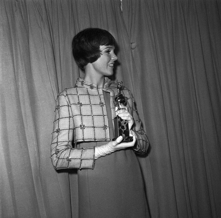 (Original Caption) Actress Julie Andrews holds her Golden Globe Award of the Hollywood Foreign Press Association after being named the world's favorite film actress for the second consecutive year. Paul Newman was named the world's most popular actor.