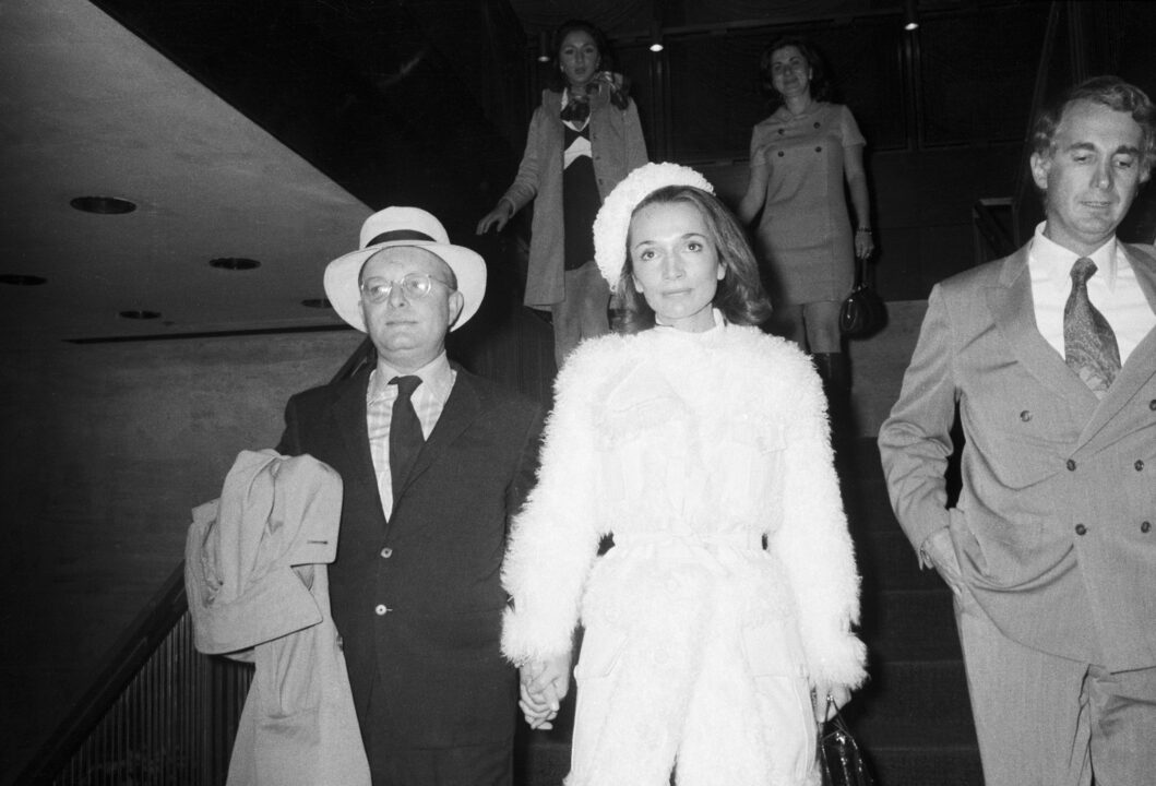 (Original Caption) 11/5/1969-New York, NY- Truman Capote leaves a reception at The Four Seasons with Princess Lee Radziwill, sister of Mrs. Jacqueline Onassis. The reception followed a screening of Capote's new film, "Trilogy," described as "an experiment in multimedia." The film was written by Capote and Eleanor Perry, whose husband produced and directed it.