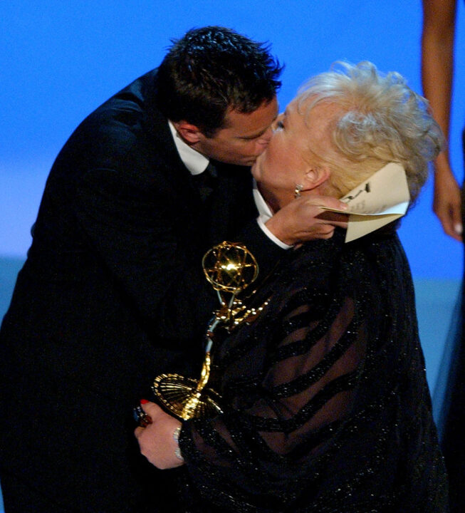 Matthew Perry kisses winner Doris Roberts for her win for Best Supporting Actress for a Comedy Series for "Everyone Loves Raymond" during The 55th Annual Primetime Emmy Awards - Show at the The Shrine Theater in Los Angeles, California