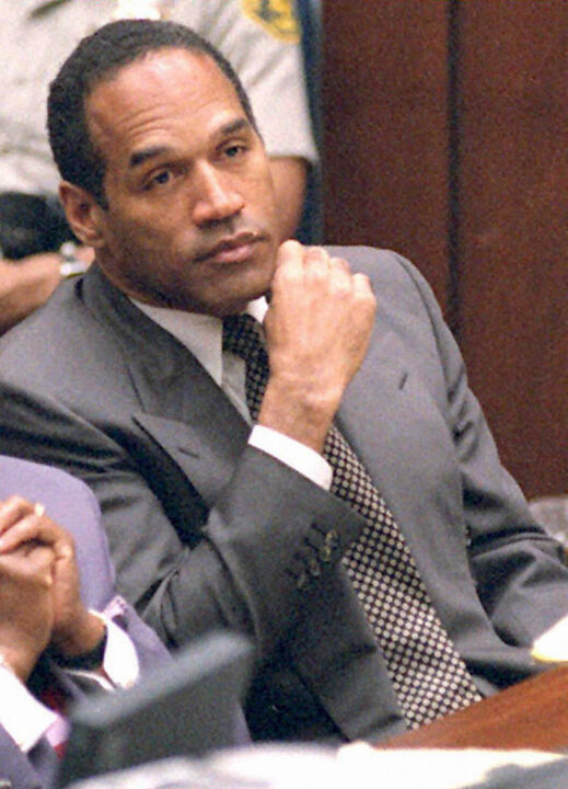 Former American football star and actor O.J. Simpson listens to testimony during his double murder trial in Los Angeles, March 16, 1995. Simpson is on trial for the homicide of his ex-wife Nicole Brown Simpson and her friend Ron Goldman. In this image he listens to the testimony of Lieutenant Philip Vannatter, one of the two lead detectives on the case.