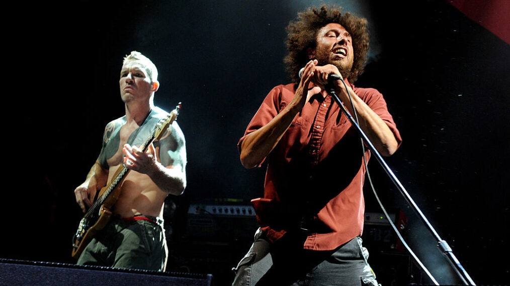 Musician Tim Commerford (L) and singer Zack de la Rocha of Rage Against the Machine performs at L.A. Rising at the L.A. Memorial Coliseum on July 30, 2011 in Los Angeles, California