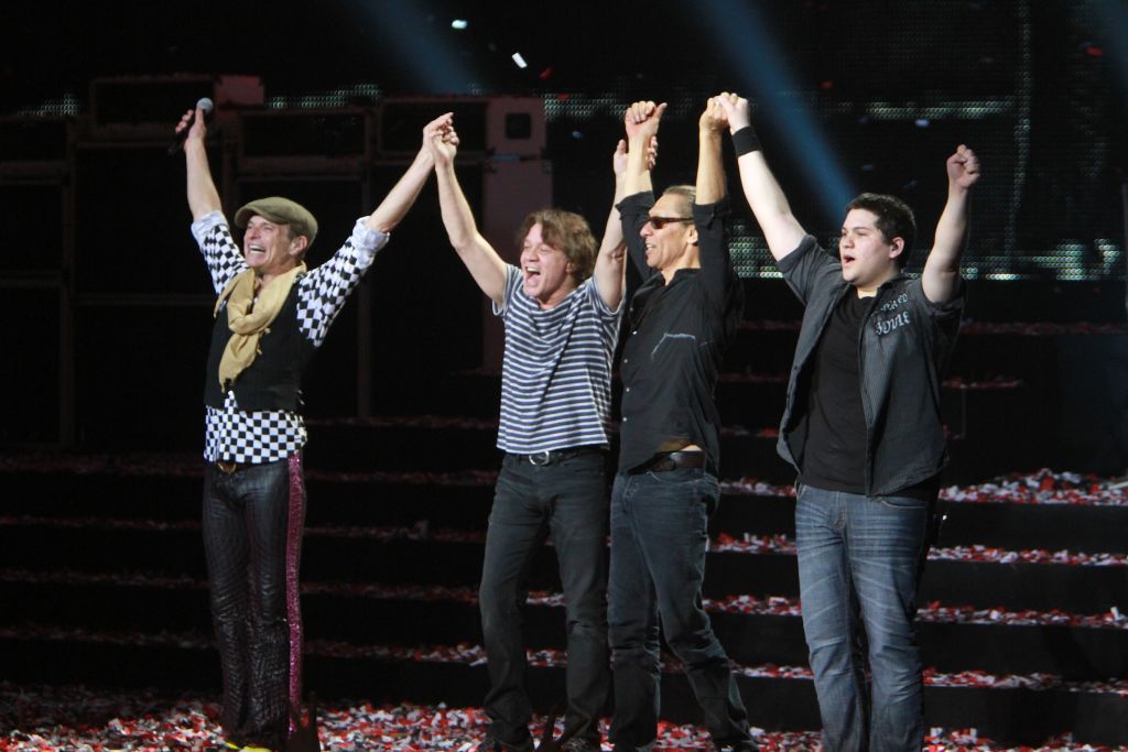 Musicians David lee Roth, Eddie, Alex and Wolfgang Van Halen are shown lined up at the end of their live concert appearance with Van Halen on March 3, 2012