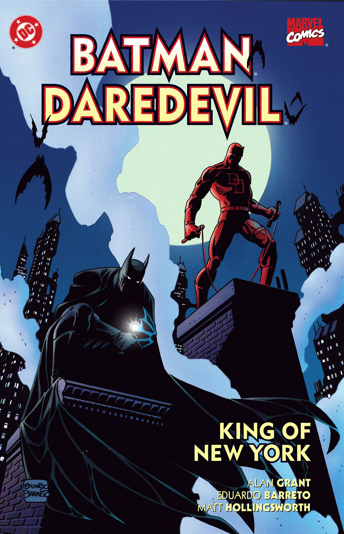 cover of the 2000 book "Batman, Daredevil: King of New York," a Marvel/DC crossover. The art is a nighttime image of Batman, crouched in the lower left, his features mostly shrouded in darkness except for his eyes, and Daredevil, standing a bit above him to the right, also with mostly just his eyes showing. They are both standing on top of a building, with skyscrapers and a full moon in the background. They are both staring intently down at something. 