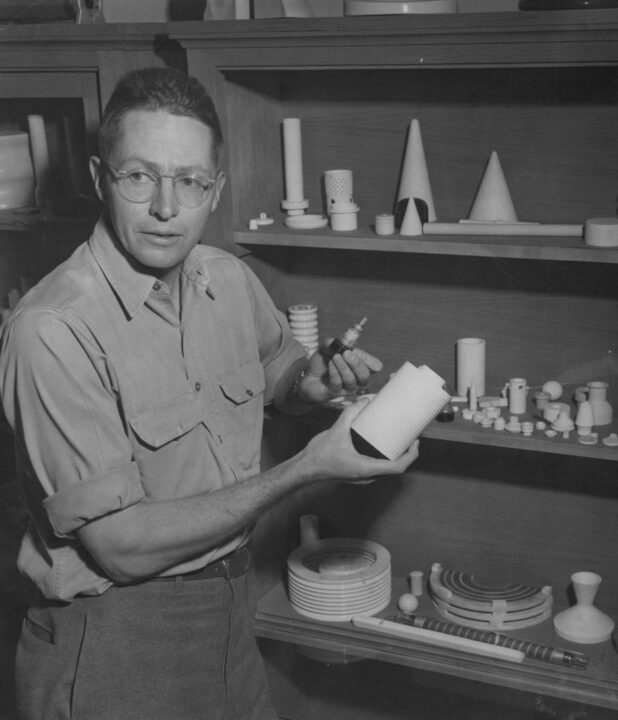 Adolph Coors III displays two of the many rador, radio and television parts manufactured at the Coors Porcelain Co. In his right hand is a radar coil, in his left, a TV tube