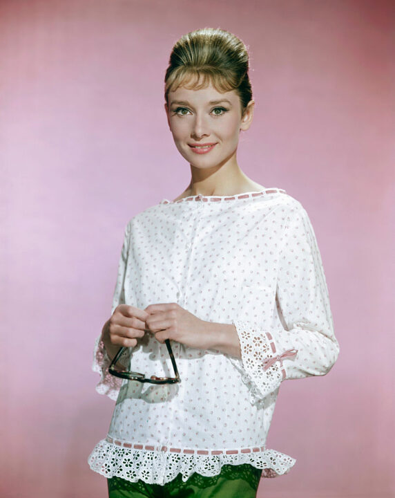 Belgian-born American actress, Audrey Hepburn (1929 - 1993), wearing a white blouse with pink flowers, circa 1963