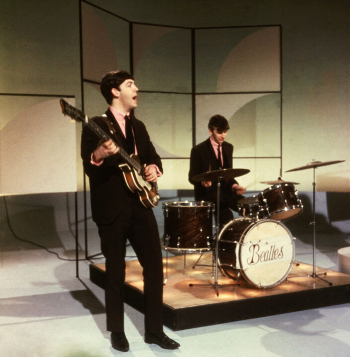 1963:  Paul McCartney and Ringo Starr of The Beatles performing during an early television performance on 'Thank Your Lucky Stars' on February 17th 1963
