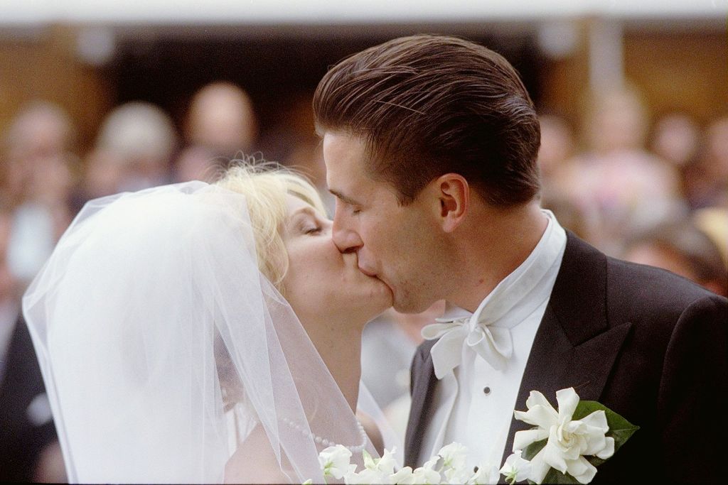 Chynna Phillips and Billy Baldwin kissing during wedding on Long Island . They were married at Sacred Heart Church in Southampton, N.Y.