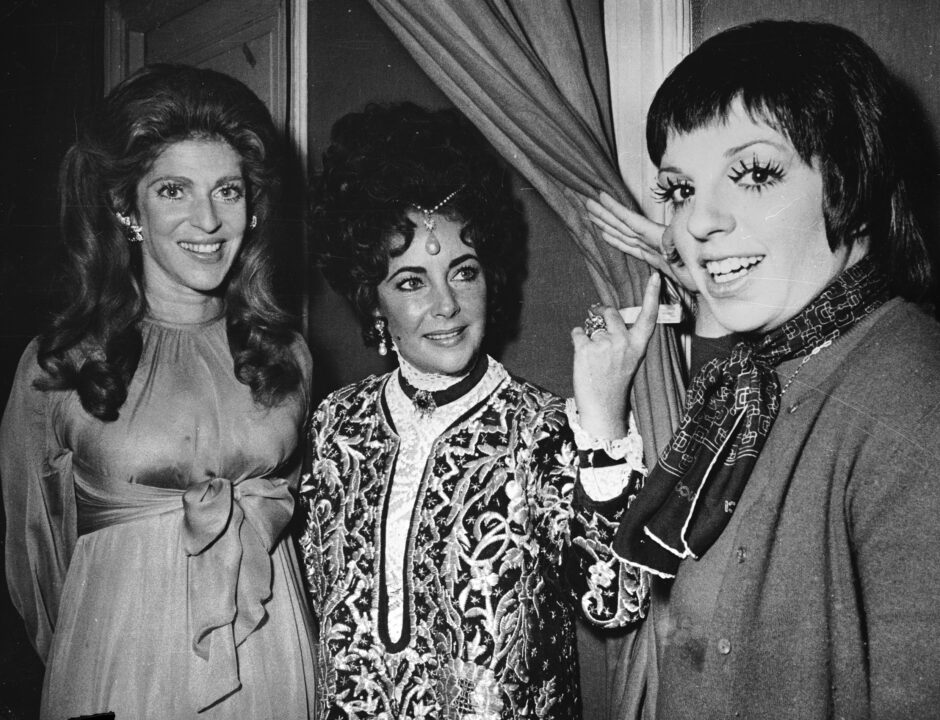8th December 1971: Film star Elizabeth Taylor (centre) wearing a £15,000 pearl which belonged to Mary Tudor. She is with dancer, film star and singer Liza Minnelli (right) and Baroness Guy De Rothschild at a show given on behalf of the United and Social Jewish Fund. 