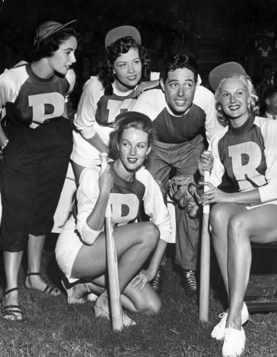 Actors Elizabeth Taylor, Ava Gardner (1922 - 1990), Jack Russell and Carole Richards pose for a group photo after their annual charity softball game in Hollywood to raise money for the youth welfare fund. 