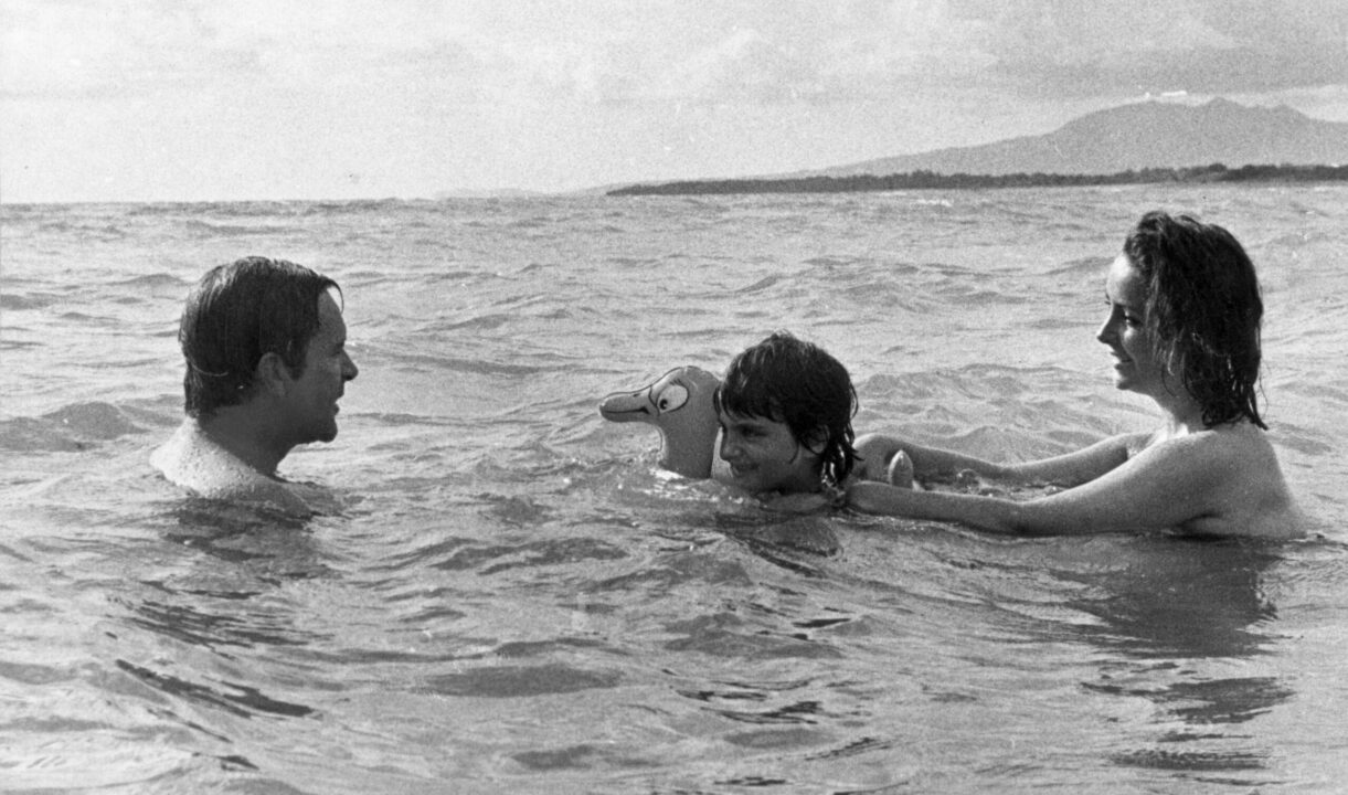 6th October 1963: Richard Burton (1925-1984) goes swimming in the sea with Elizabeth Taylor and her daughter Liza Todd, during filming of 'Night of the Iguana' in Mexico. 